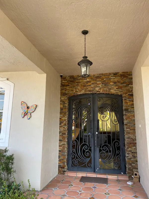 Security camera above the front entrance of a Miami home